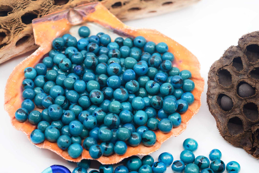 Deep Turquoise Blue Acai Beads close-up showing a selection of beads for jewelry making.