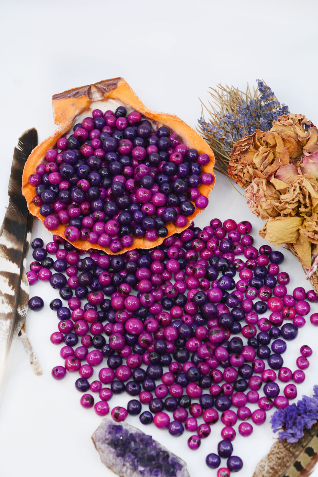 A beautiful display of purple acai beads for jewelry making.