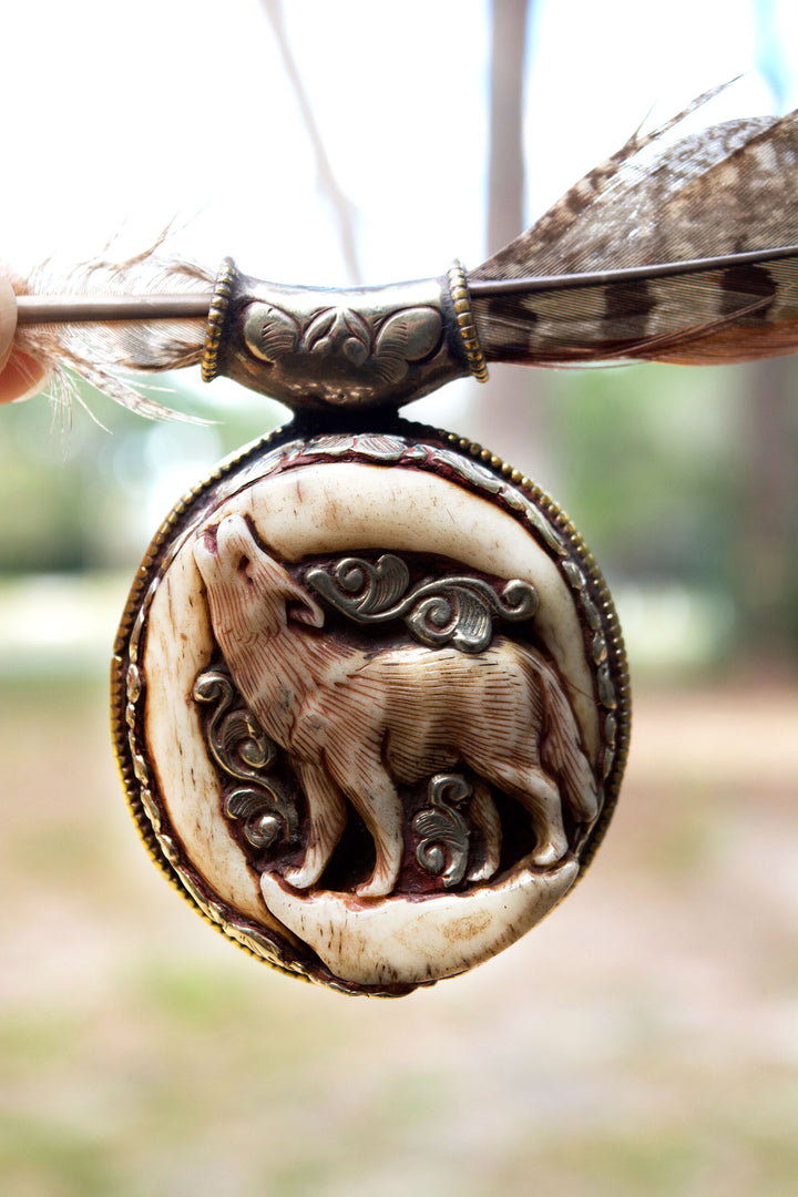 The Howling in Silver: 2 1/4 x 2 3/4 inches Handcarved in Bone, Buffalo Pendant set in Sterling Silver - OOAK