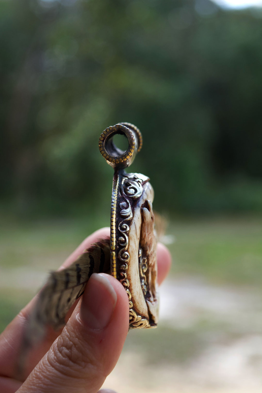 The Howling in Silver: 2 1/4 x 2 3/4 inches Handcarved in Bone, Buffalo Pendant set in Sterling Silver - OOAK