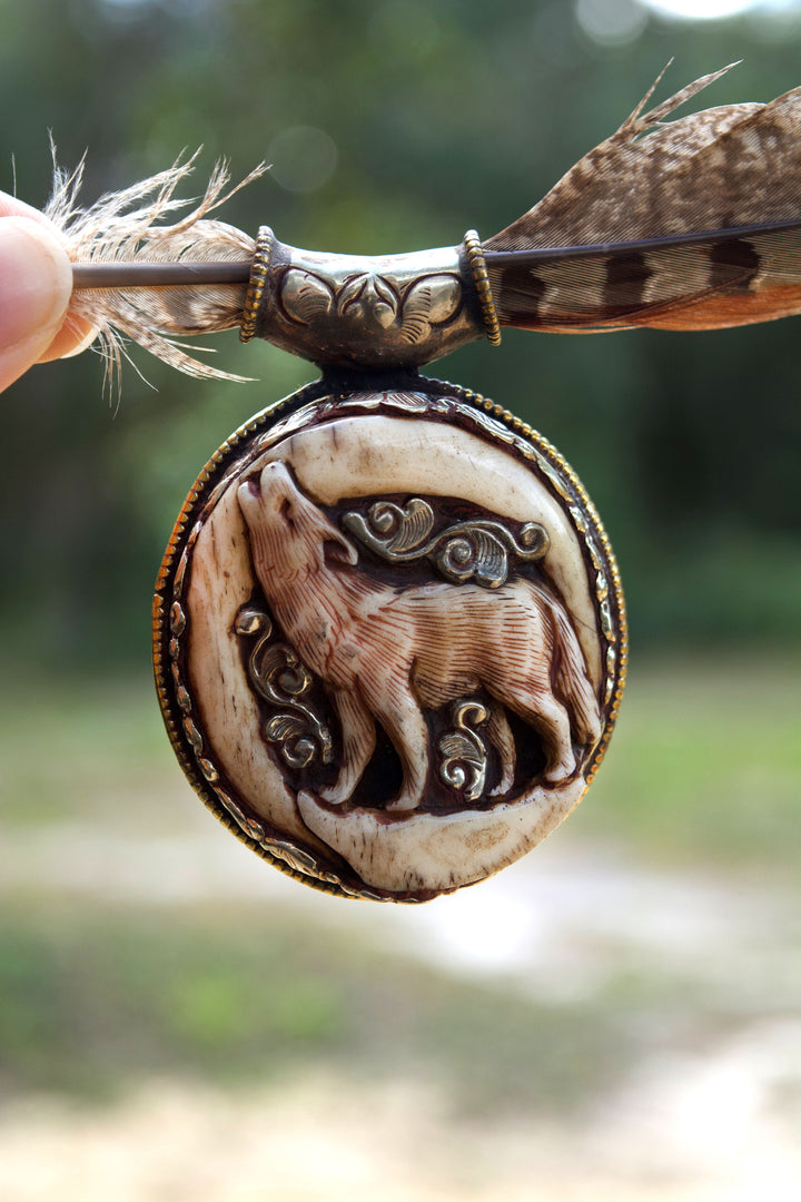 The Howling in Silver: 2 1/4 x 2 3/4 inches Handcarved in Bone, Buffalo Pendant set in Sterling Silver - OOAK