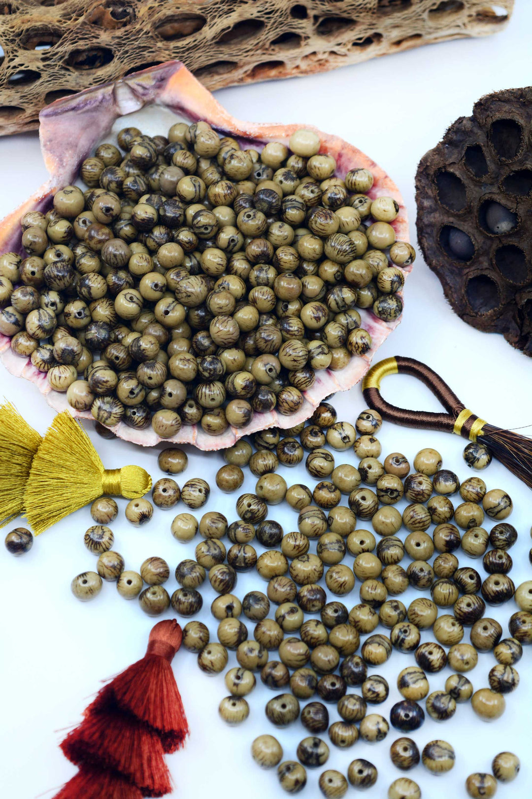 A beautiful display of Green acai beads for jewelry making.